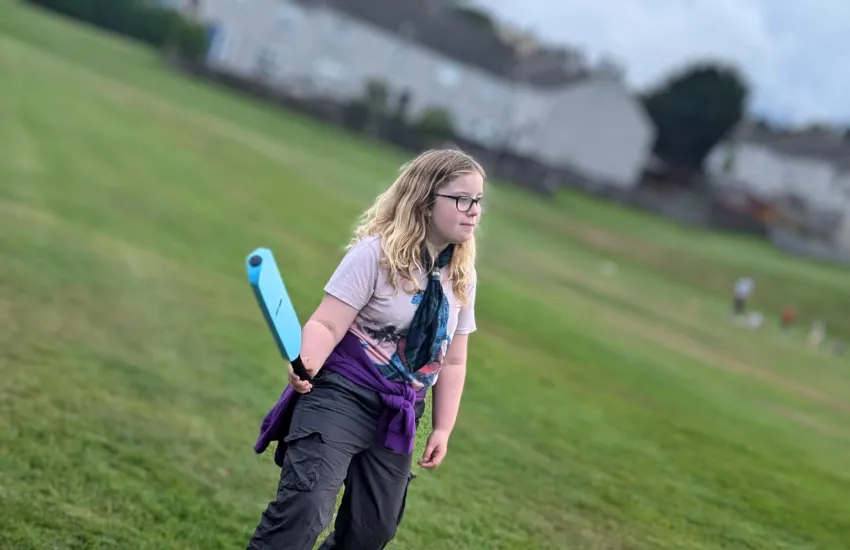 a scout getting ready to bat at rounders