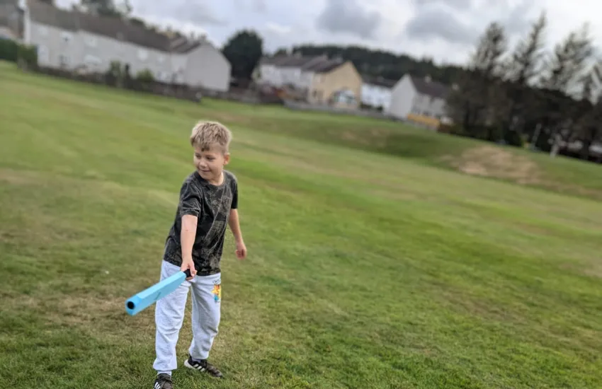 a male scout getting ready at rounders