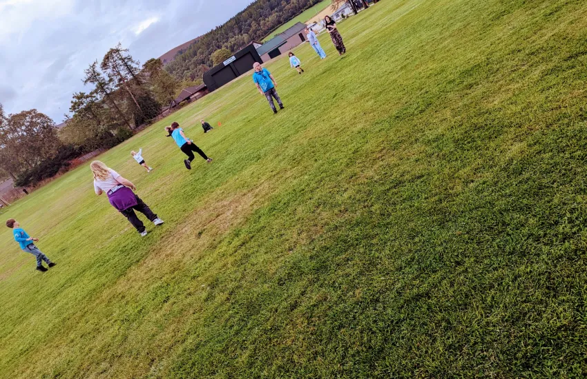 a collection of young people playing rounders