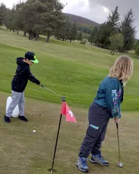 Scouts playing golf