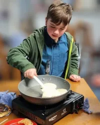 Cubs and scouts making pancakes