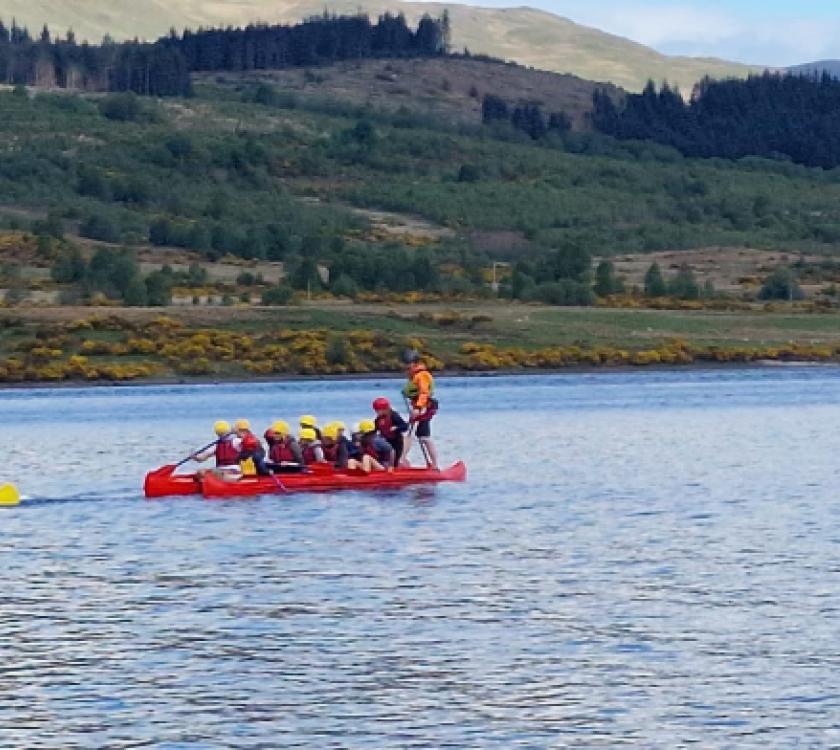 Scouts in rafts on a loch
