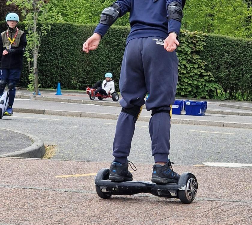 male scout on a hover board 