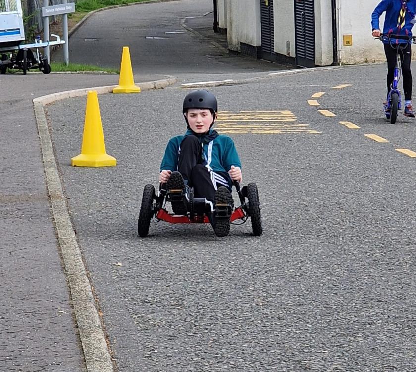 male scout on a go cart