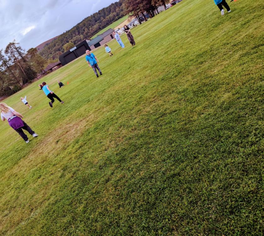 a collection of young people playing rounders