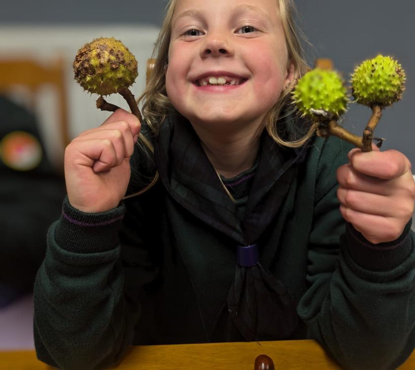 a cub with her conkers