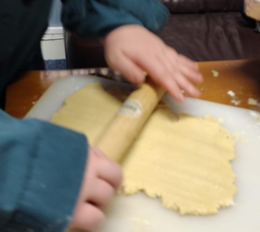 A scout rolling out shortbread