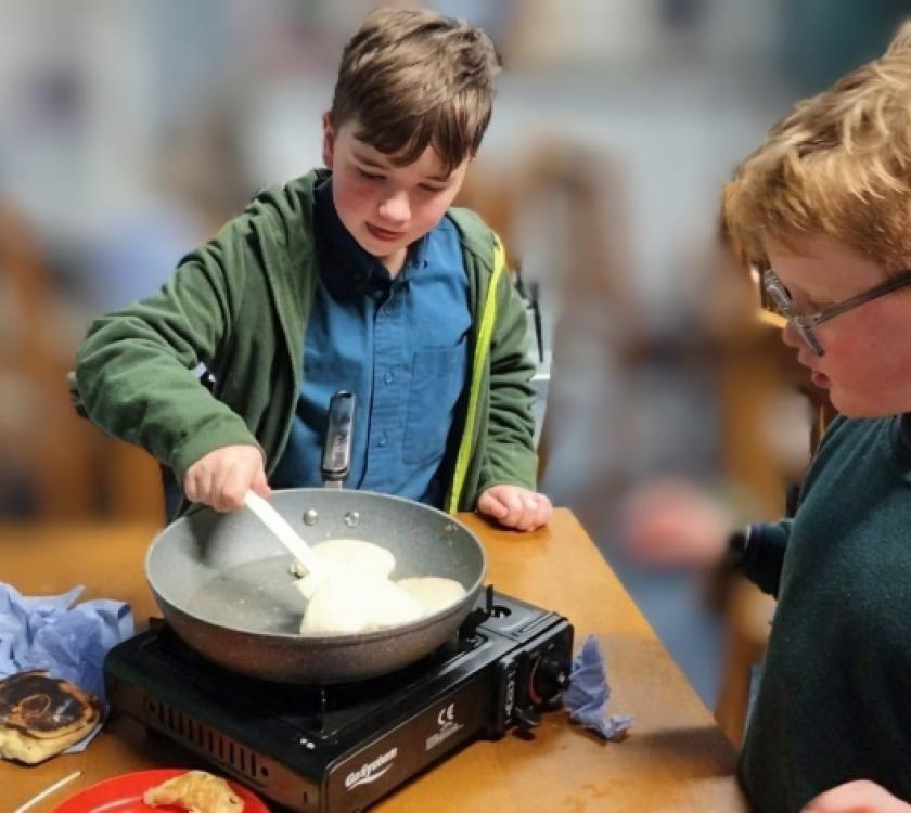 Cubs and scouts making pancakes