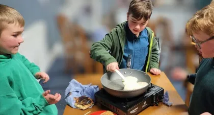 Cubs and scouts making pancakes